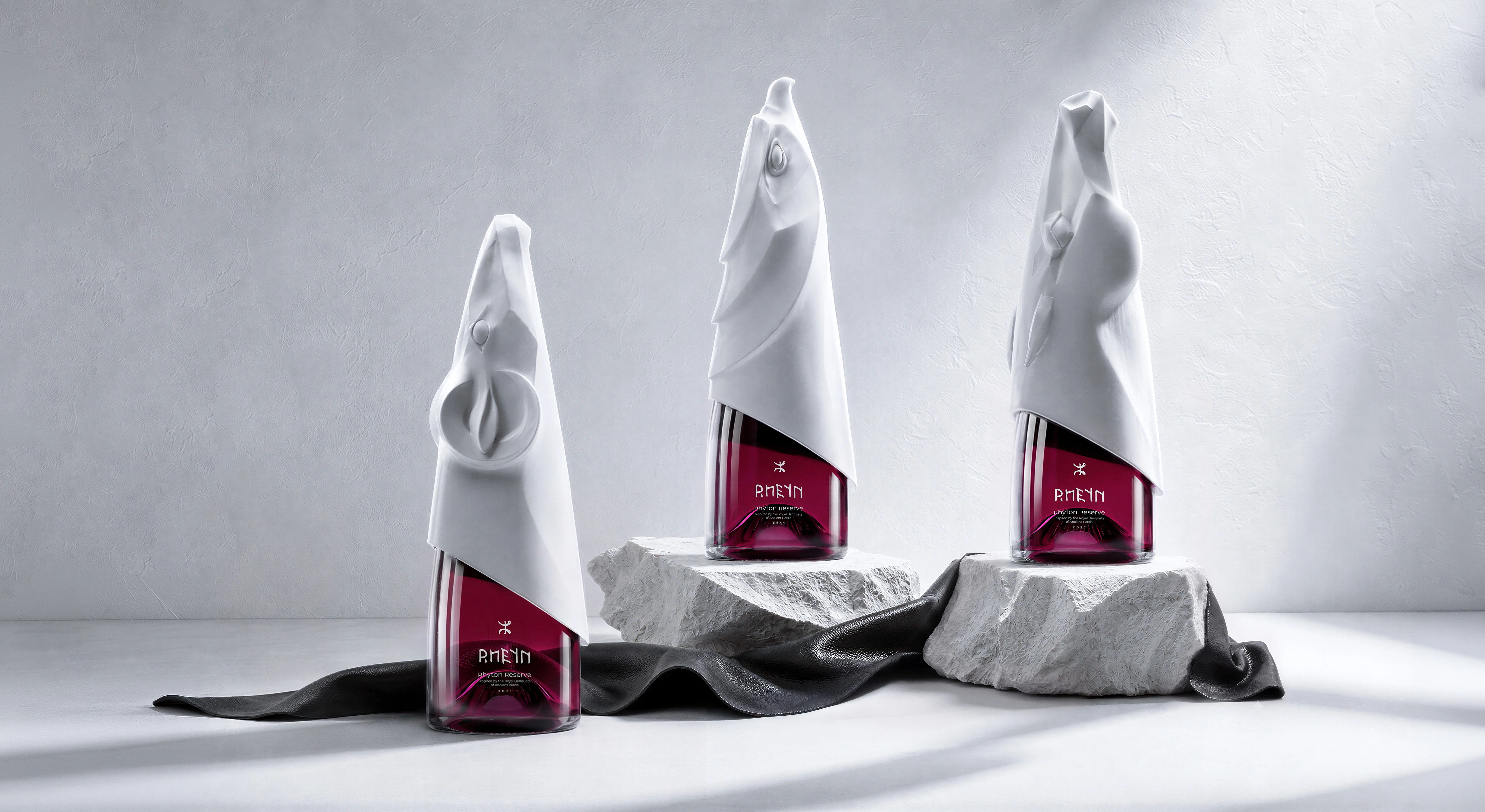 Three RHEYN Rhyton Reserve bottles showcasing DEEEZ’s sculptural beverage packaging design.